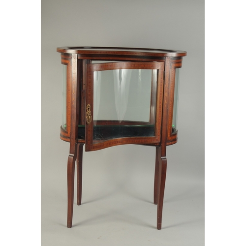 1063 - A GOOD MAHOGANY KIDNEY SHAPED BIJOUTERIE CABINET with glass sides and glass door, opening to reveal ... 