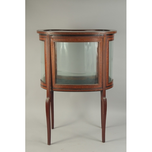 1063 - A GOOD MAHOGANY KIDNEY SHAPED BIJOUTERIE CABINET with glass sides and glass door, opening to reveal ... 