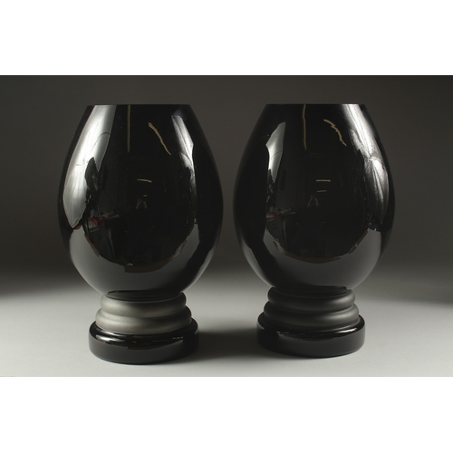 1079 - A LARGE PAIR OF ART DECO COLUMN GLASS VASES. 12ins high.