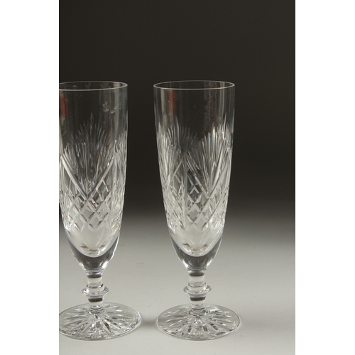 1080 - A PAIR OF CUT GLASS WINE FLUTES.