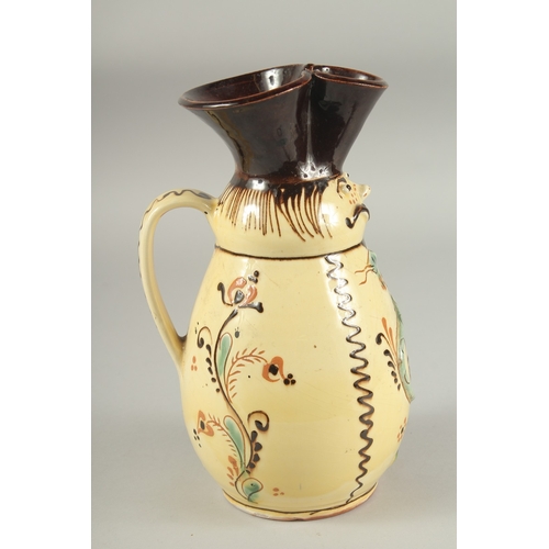 1106 - A HUNGARIAN ART POTTERY MISKO WINE JUG with a man's  face and snake. Signed.  9ins high.