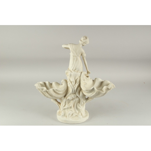 1114 - A WHITE BISQUE SHELL GROUP, a young girl with a fish, on a circular base. 1ft 5ins high.