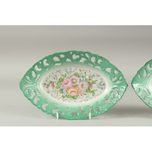 1117 - A PAIR OF SEVRES DESIGN PORCELAIN OVAL PIERCED FLORAL DISHES. 10ins diameter.