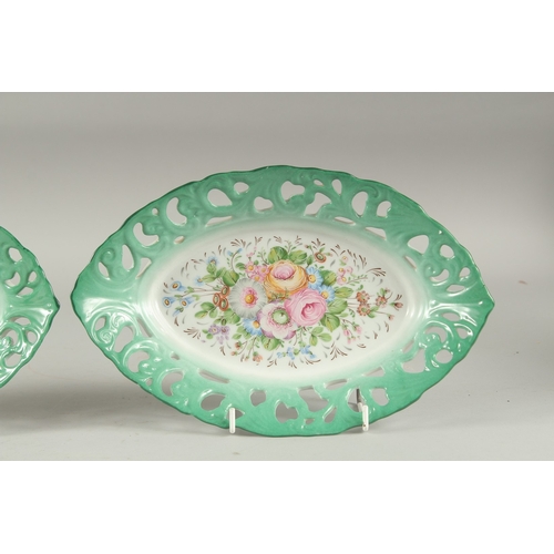 1117 - A PAIR OF SEVRES DESIGN PORCELAIN OVAL PIERCED FLORAL DISHES. 10ins diameter.