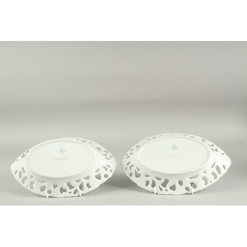 1117 - A PAIR OF SEVRES DESIGN PORCELAIN OVAL PIERCED FLORAL DISHES. 10ins diameter.