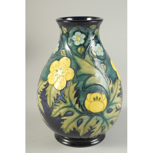 1124 - A MOORCROFT  BULBOUS FLORAL VASE. W. A. Monogrammed. 7.5ins high.