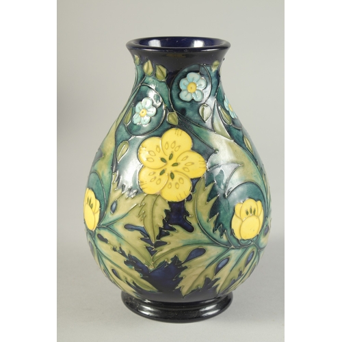 1124 - A MOORCROFT  BULBOUS FLORAL VASE. W. A. Monogrammed. 7.5ins high.