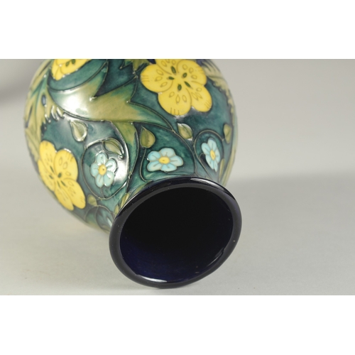 1124 - A MOORCROFT  BULBOUS FLORAL VASE. W. A. Monogrammed. 7.5ins high.