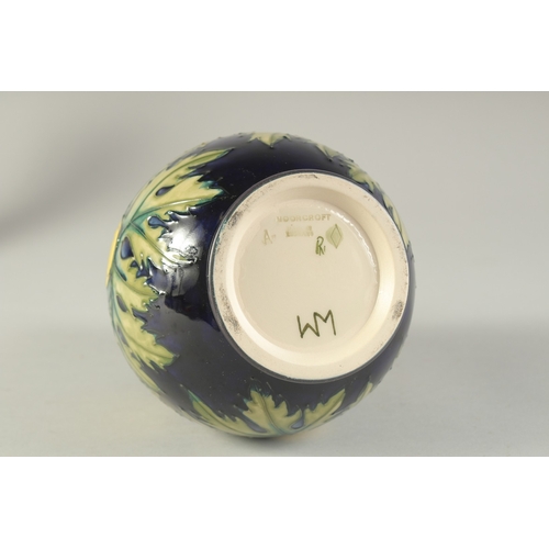 1124 - A MOORCROFT  BULBOUS FLORAL VASE. W. A. Monogrammed. 7.5ins high.