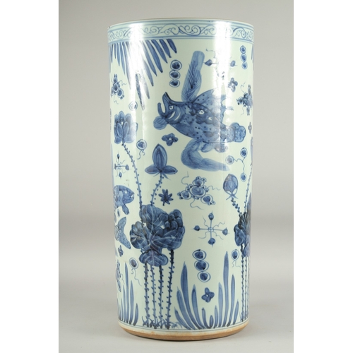 1156 - A LARGE CHINESE BLUE AND WHITE PORCELAIN STICK STAND decorated with flowers and birds. 2ft high, 11i... 