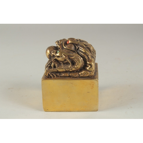 1158 - A CHINESE BRONZE SQUARE SEAL with dragons. 2.75ins .