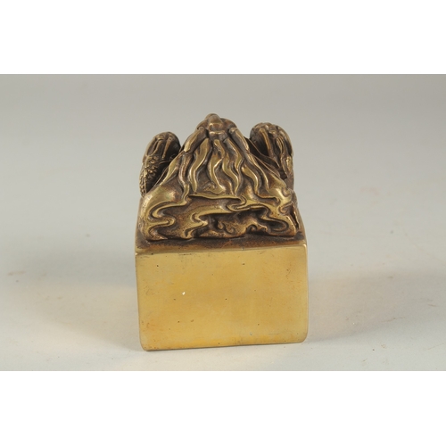 1158 - A CHINESE BRONZE SQUARE SEAL with dragons. 2.75ins .