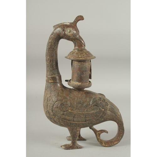 1160 - A CHINESE ARCHAIC BRONZE BIRD CENSOR. 13ins high.