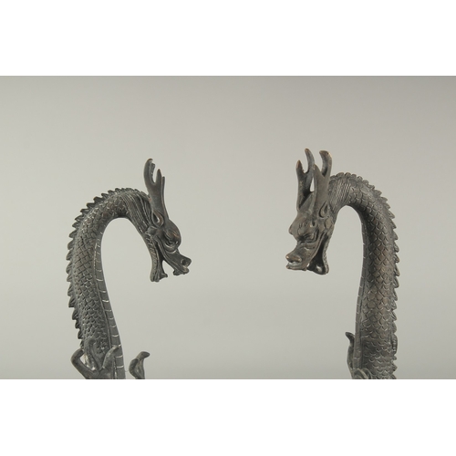 1161 - A PAIR OF CHINESE BRONZE DRAGONS. 1ft 4ins high.