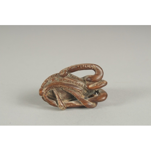 1174 - A HARDWOOD OCTOPUS NETSUKE.