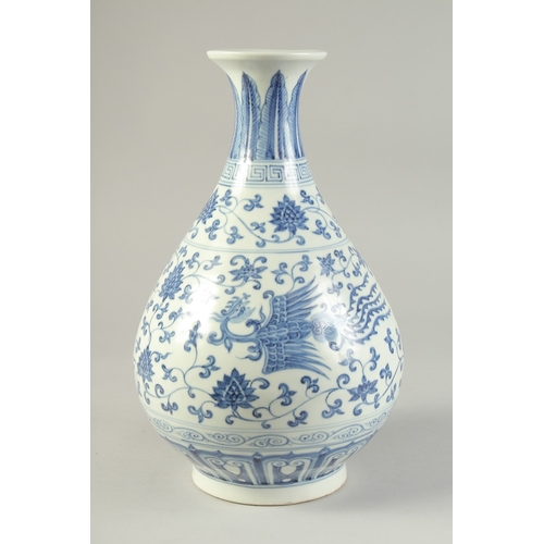 1185 - A  CHINESE BLUE AND WHITE PORCELAIN VASE painted with phoenix and lotus.  33cm high.