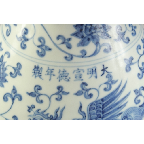 1185 - A  CHINESE BLUE AND WHITE PORCELAIN VASE painted with phoenix and lotus.  33cm high.