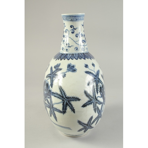 1186 - A  CHINESE BLUE AND WHITE PORCELAIN  MOON FLASK with floral decoration.  31cm high.