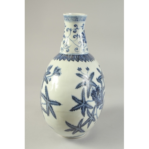 1186 - A  CHINESE BLUE AND WHITE PORCELAIN  MOON FLASK with floral decoration.  31cm high.