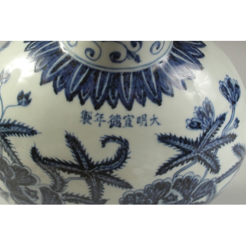 1186 - A  CHINESE BLUE AND WHITE PORCELAIN  MOON FLASK with floral decoration.  31cm high.