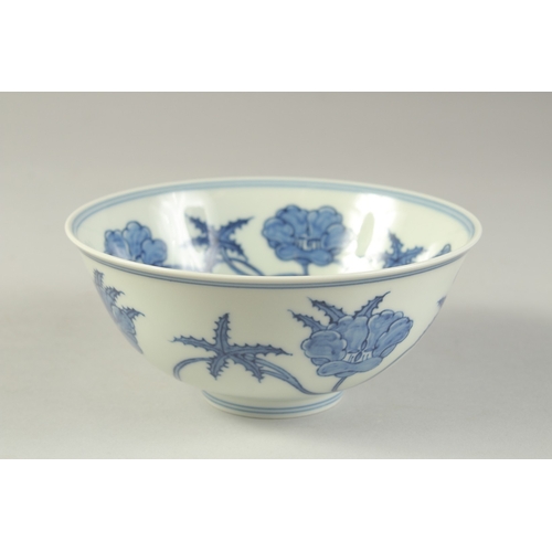 1187 - A  CHINESE BLUE AND WHITE PORCELAIN BOWL painted with flower heads.  15cm diameter.