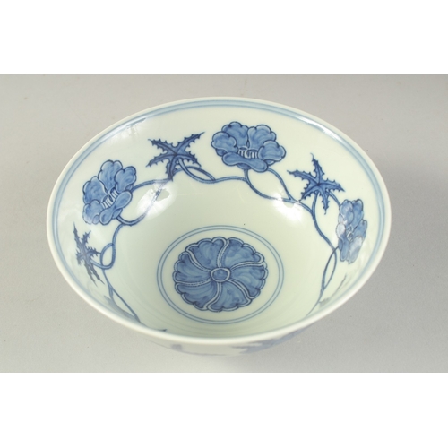 1187 - A  CHINESE BLUE AND WHITE PORCELAIN BOWL painted with flower heads.  15cm diameter.