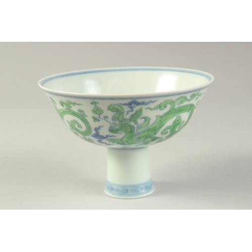 1188 - A CHINESE FAMILLE VERTE PORCELAIN STEM CUP with kui dragons. 15.5cm diameter.