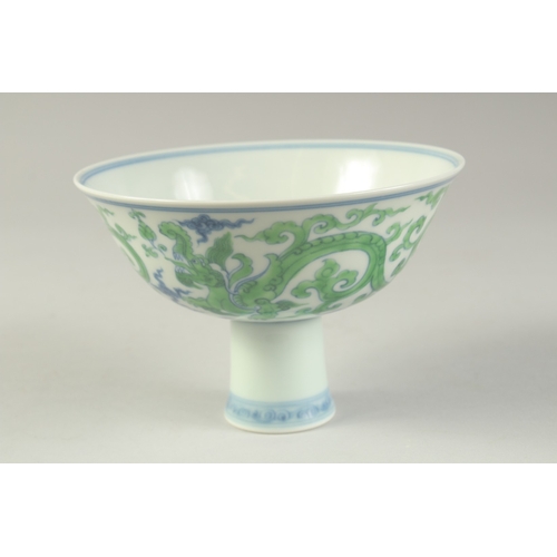 1188 - A CHINESE FAMILLE VERTE PORCELAIN STEM CUP with kui dragons. 15.5cm diameter.