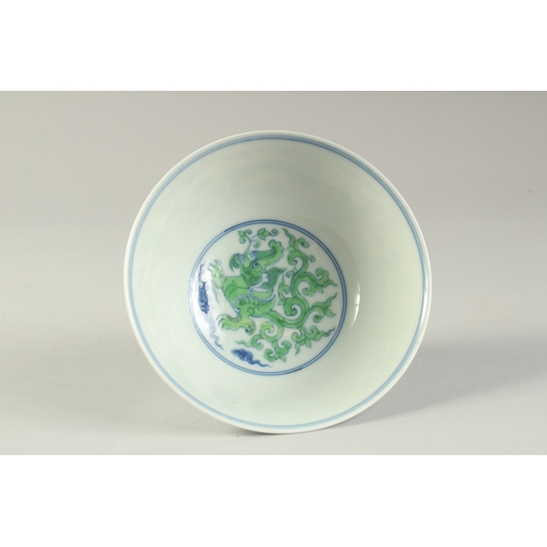 1188 - A CHINESE FAMILLE VERTE PORCELAIN STEM CUP with kui dragons. 15.5cm diameter.