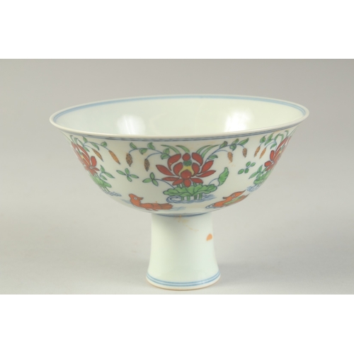 1189 - A CHINESE DONCAI PORCELAIN STEM CUP with flowers and duck.  15.5cm diameter.