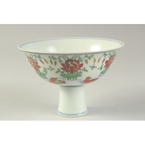 1189 - A CHINESE DONCAI PORCELAIN STEM CUP with flowers and duck.  15.5cm diameter.