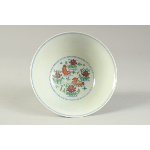 1189 - A CHINESE DONCAI PORCELAIN STEM CUP with flowers and duck.  15.5cm diameter.