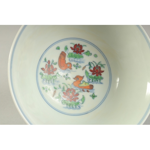 1189 - A CHINESE DONCAI PORCELAIN STEM CUP with flowers and duck.  15.5cm diameter.