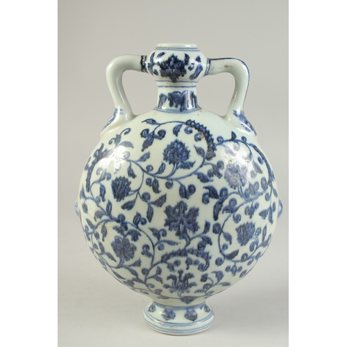 1192 - A CHINESE BLUE AND WHITE LOTUS MOON FLASK.  28cm high.