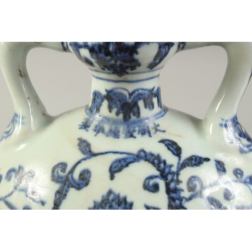 1192 - A CHINESE BLUE AND WHITE LOTUS MOON FLASK.  28cm high.