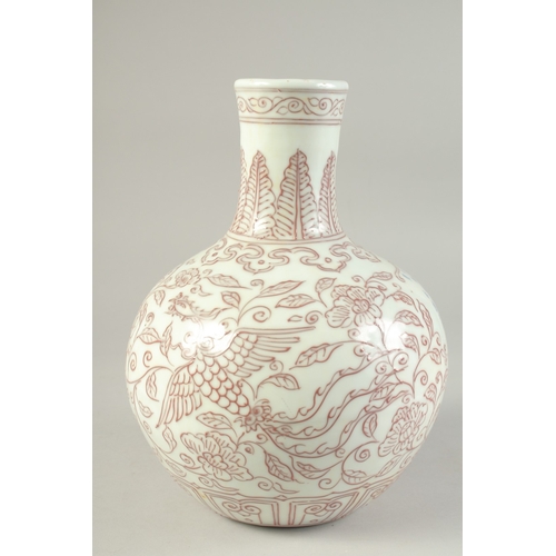 1194 - A CHINESE UNDERGLAZE RED VASE with phoenix and flora.  27ins high.