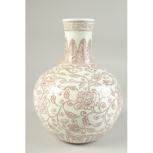 1194 - A CHINESE UNDERGLAZE RED VASE with phoenix and flora.  27ins high.