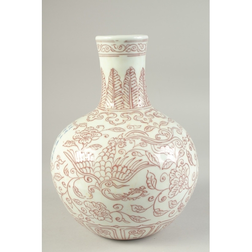 1194 - A CHINESE UNDERGLAZE RED VASE with phoenix and flora.  27ins high.