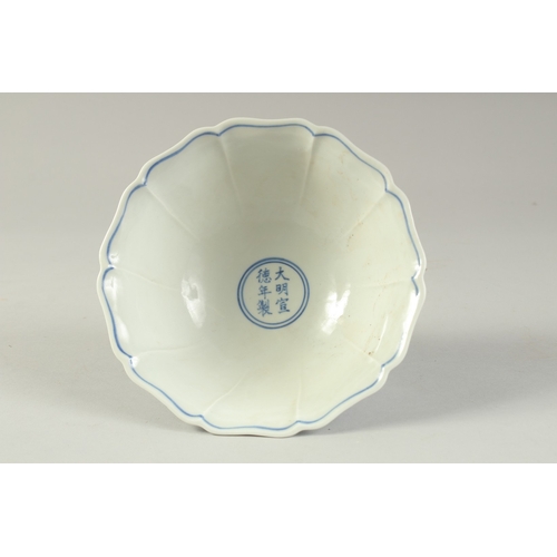 1196 - A CHINESE BLUE AND WHITE PETAL FORM STEM CUP.  17cm wide.