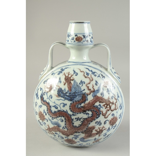 1199 - A CHINESE BLUE AND UNDERGLAZE RED PORCELAIN DRAGON MOON FLASK, 30cm high