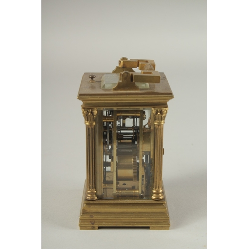 1204 - A SMALL 19TH CENTURY FRENCH BRASS REPEATER  CARRIAGE CLOCK with cream dial, Roman numerals and colum... 