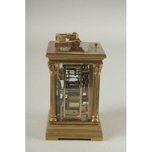 1204 - A SMALL 19TH CENTURY FRENCH BRASS REPEATER  CARRIAGE CLOCK with cream dial, Roman numerals and colum... 