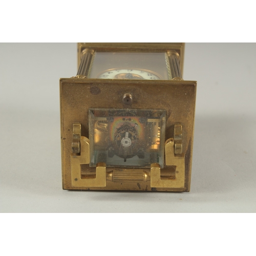 1204 - A SMALL 19TH CENTURY FRENCH BRASS REPEATER  CARRIAGE CLOCK with cream dial, Roman numerals and colum... 