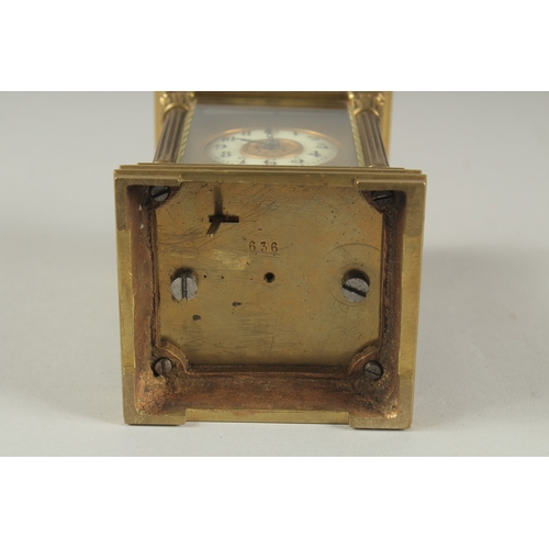 1204 - A SMALL 19TH CENTURY FRENCH BRASS REPEATER  CARRIAGE CLOCK with cream dial, Roman numerals and colum... 