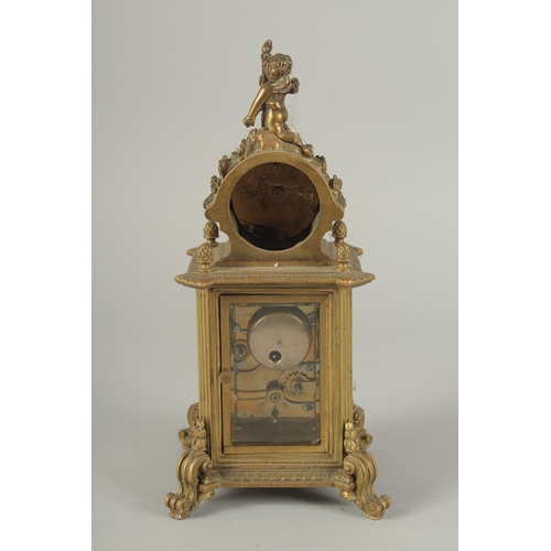 1205 - A 19TH CENTURY FRENCH BRASS CLOCK surrounded by a barometer 8ins high.