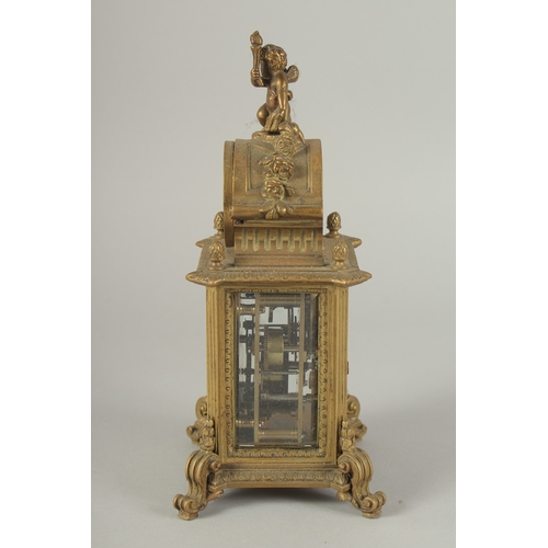 1205 - A 19TH CENTURY FRENCH BRASS CLOCK surrounded by a barometer 8ins high.