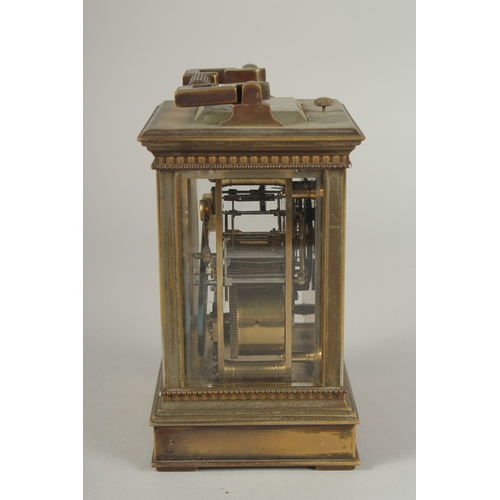 1206 - A 19TH CENTURY FRENCH BRASS CARRIAGE CLOCK with column sides.  No. 6927. 5ins high.