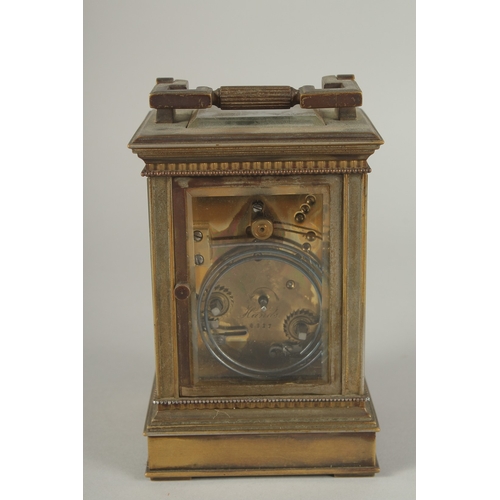 1206 - A 19TH CENTURY FRENCH BRASS CARRIAGE CLOCK with column sides.  No. 6927. 5ins high.