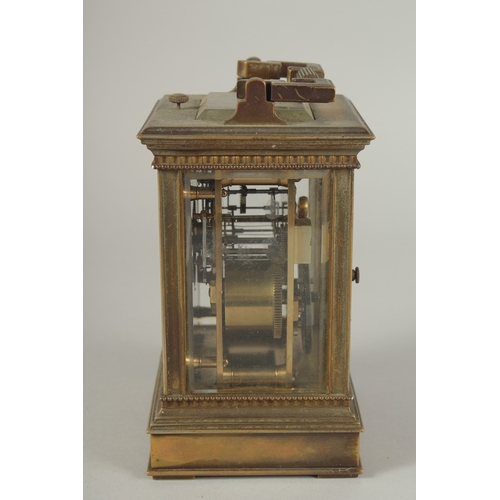 1206 - A 19TH CENTURY FRENCH BRASS CARRIAGE CLOCK with column sides.  No. 6927. 5ins high.