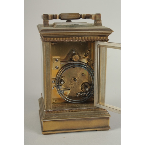 1206 - A 19TH CENTURY FRENCH BRASS CARRIAGE CLOCK with column sides.  No. 6927. 5ins high.